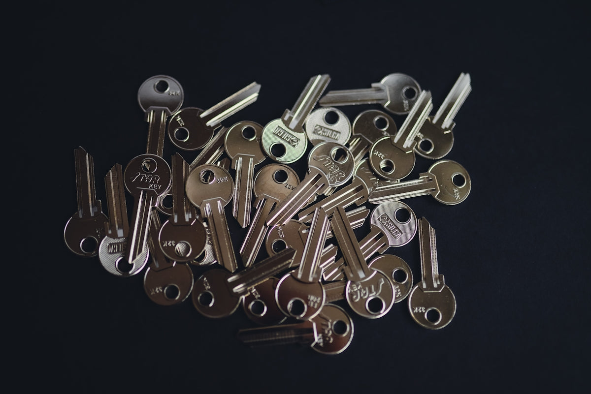 a pile of keys sitting on top of a table