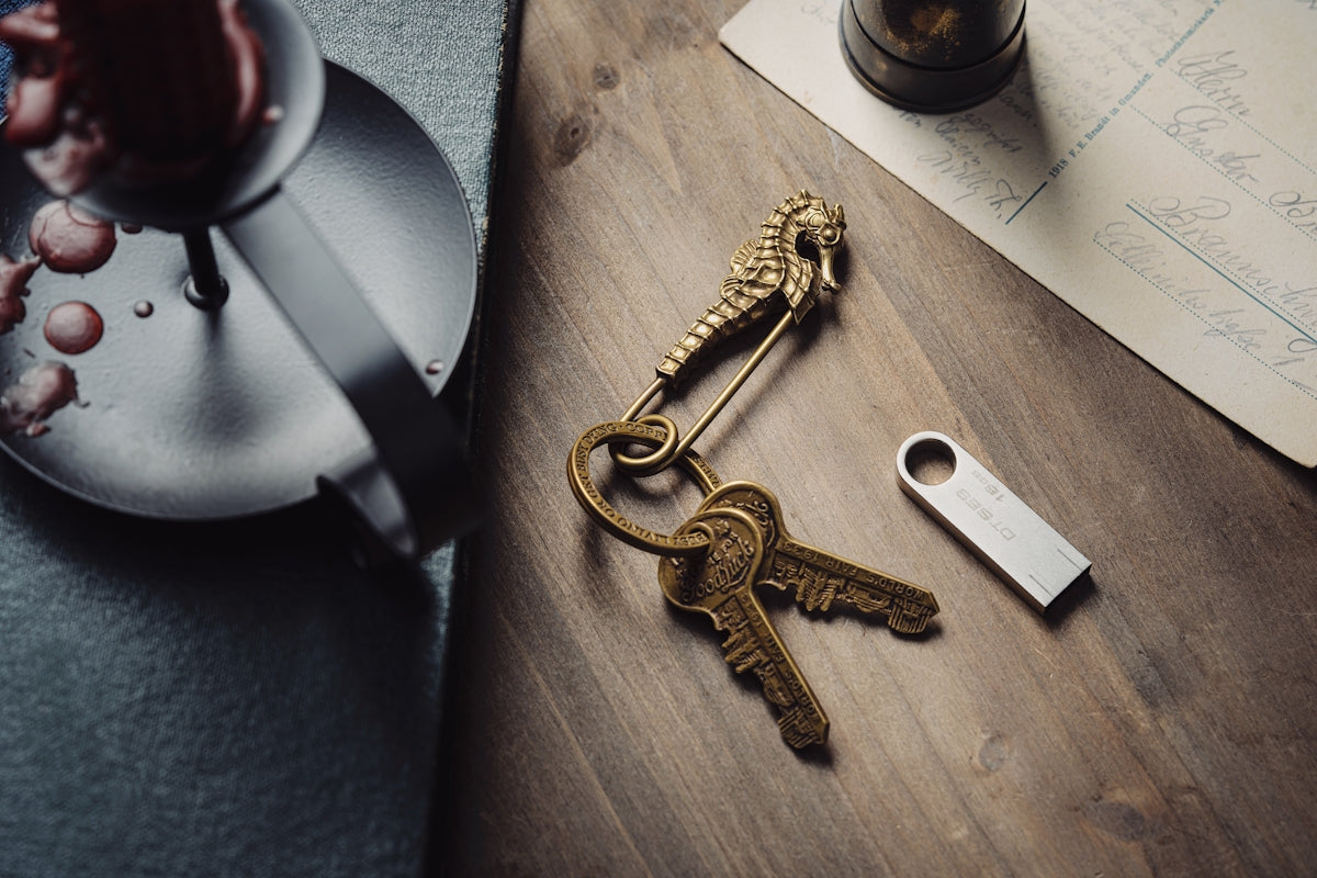 a bunch of keys sitting on top of a wooden table